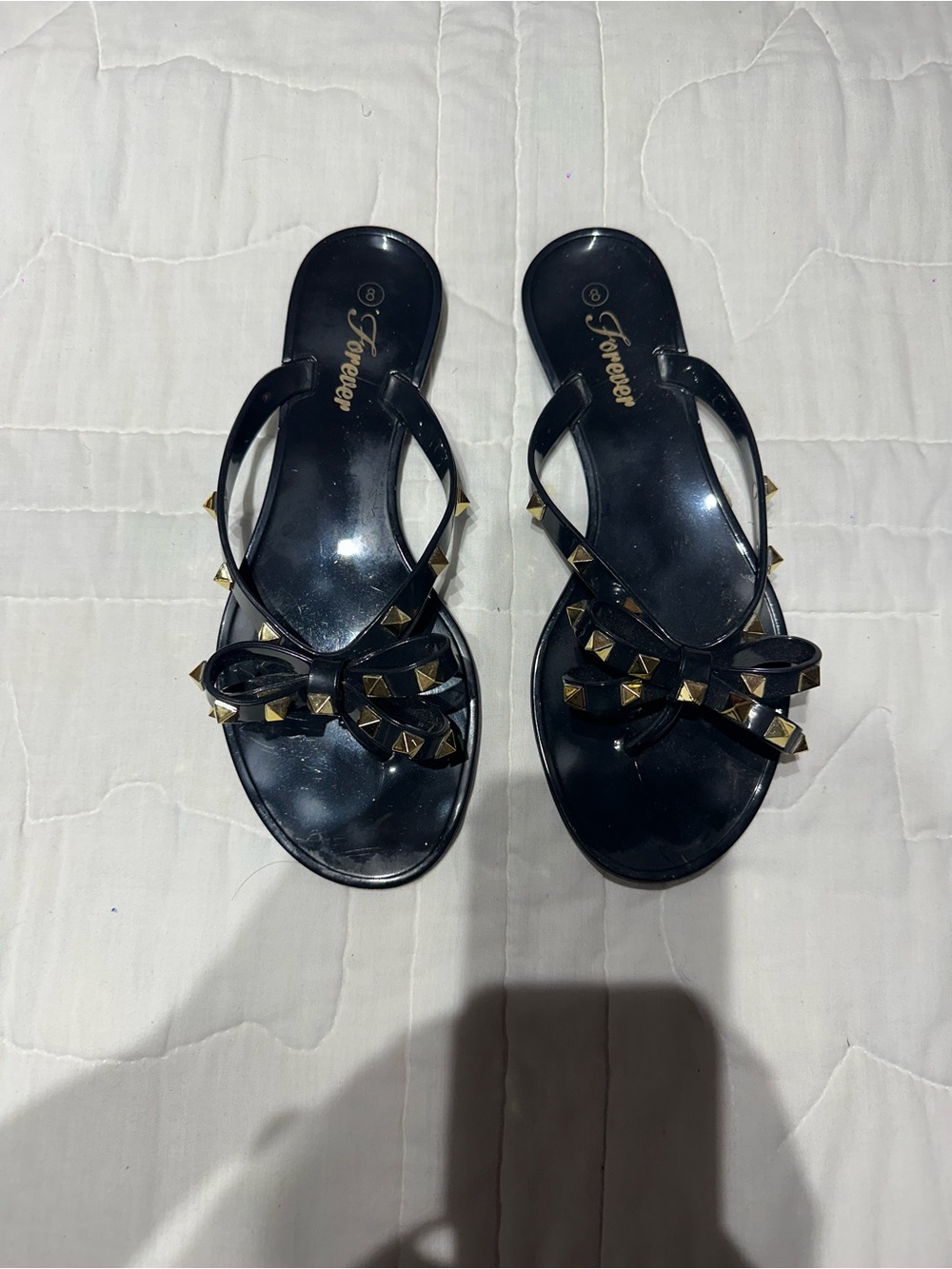 Black studded flip flops